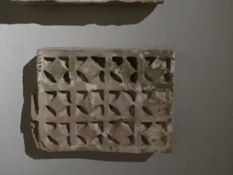 Geometrically derived cross on an architectural ornament